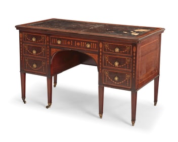 An Edwardian marquetry kneehole desk