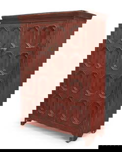 A Canadian stained pine cabinet: A Canadian stained pine cabinetFirst half 19th century, Frontenac or Victoria countyOf mortise and tenon construction, the reeded cornice above two cabinet doors fitted with octagonal panels with fan