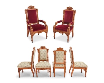 A set of twelve Horner-style Renaissance Revival oak dining chairs