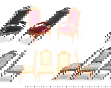 A set of twelve Horner-style Renaissance Revival oak dining chairs: A set of twelve Horner-style Renaissance Revival oak dining chairsMid/late 19th centuryComprising ten side chairs with floral pattern fabric upholstery and two armchairs with red velvet upholstery, ea