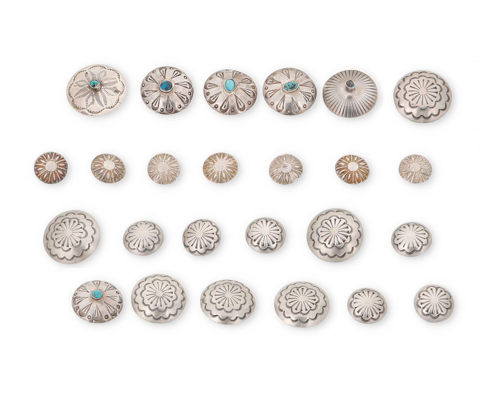 A group of Navajo silver concho buttons (1 of 2)