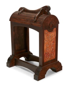 A wood and copper saddle stand