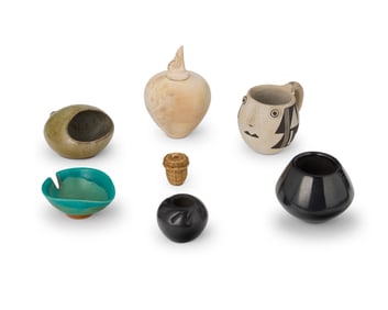 A collection of miniature Southwest-style pottery