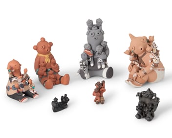 A group of Southwest Pueblo mudhead pottery storytellers