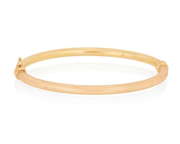 An 18K Rose Gold Bangle