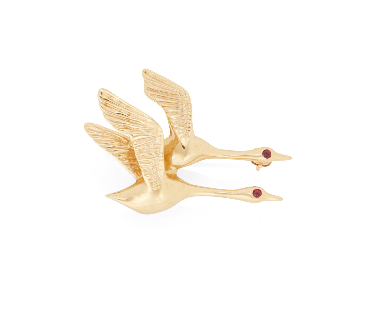 A Gold and Ruby Brooch: A Gold and Ruby BroochFeaturing two flying geese finished with round rubies eyesMeasures: 1 1/4 x 3/4 in.3.5 grams gross