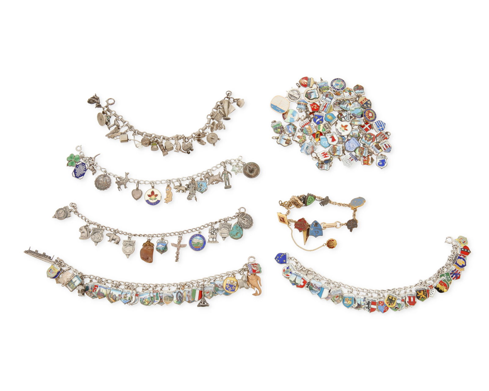A Group of Vintage Charms and Bracelets: A Group of Vintage Charms and BraceletsComprising six chain link charm bracelets, each with various souvenir or commemorative charms in sterling silver or mixed metal, most enamel shield charms from v