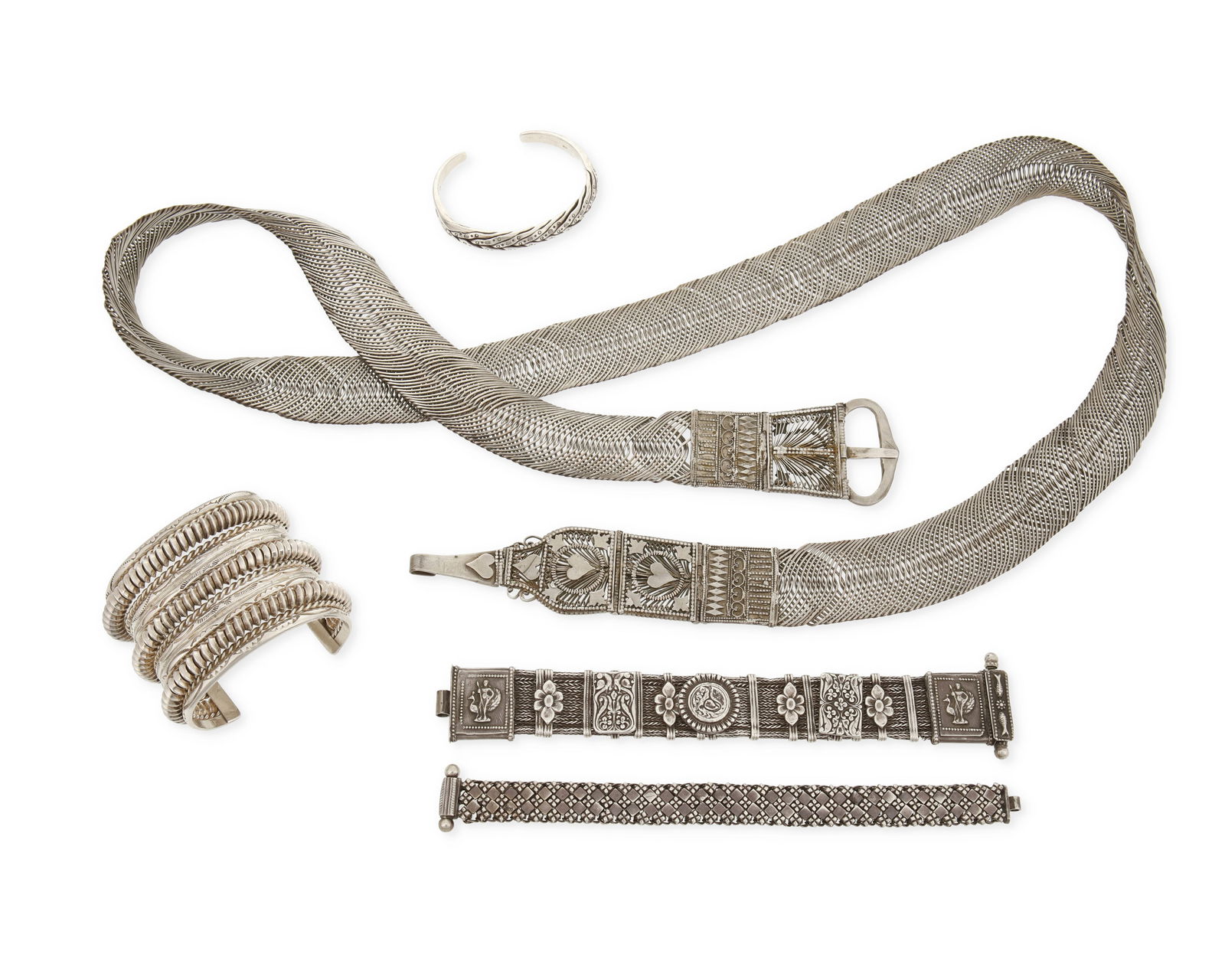 A Group of Sterling Silver and Mixed Metal Jewelry: A Group of Sterling Silver and Mixed Metal JewelryFive works comprising two Southwest-style sterling silver cuffs, together with two Rajasthani-style Indian sterling silver link bracelets, and a simil
