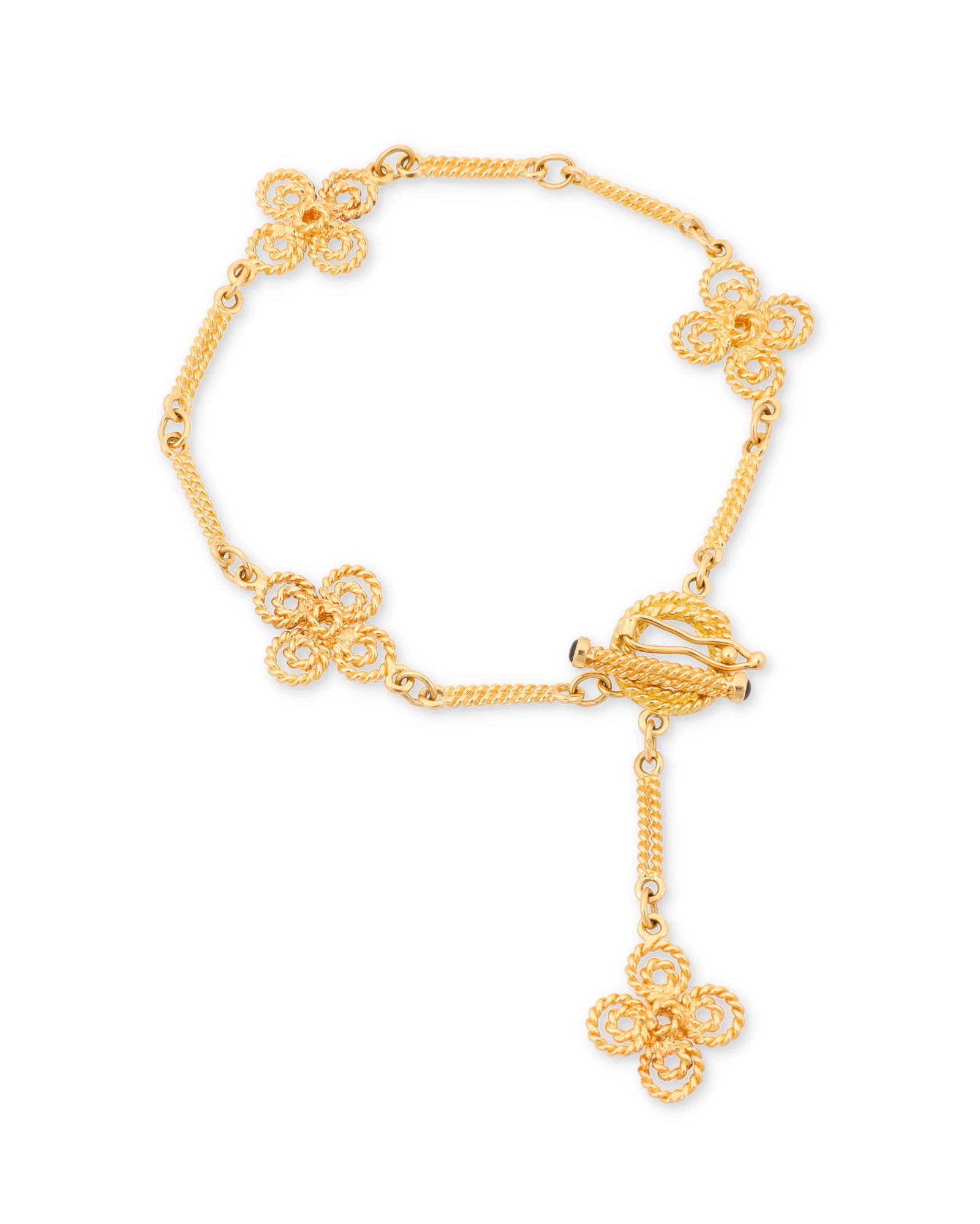 Roberto Coin: An 18K Gold Bracelet: Roberto Coin: An 18K Gold BraceletFeaturing four quatrefoil elements connected by fancy bar links, signed Roberto Coin with Italian assay marksLength: 7 1/4 in.10.5 grams grossProperty of Eddy Jo Bern