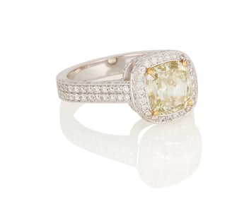 An 18K White Gold, Fancy Grayish Greenish Yellow Diamond and Diamond Ring