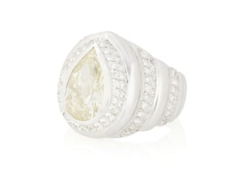 An 18K White Gold, Colored Diamond and Diamond Ring