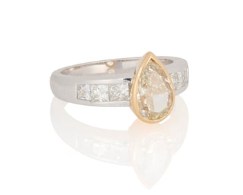 An 18K Bi-Color Gold, Colored Diamond and Diamond Ring