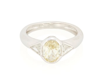 An 18K White Gold, Colored Diamond and Diamond Ring