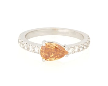 An 18K White Gold, Fancy Deep Yellowish Orange Diamond and Diamond Ring