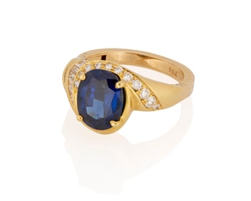 An 18K Gold, Sapphire and Diamond Ring