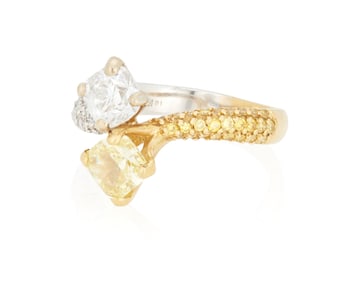 An 18K Bi-Color Gold, Fancy Intense Yellow Diamond and Diamond Ring