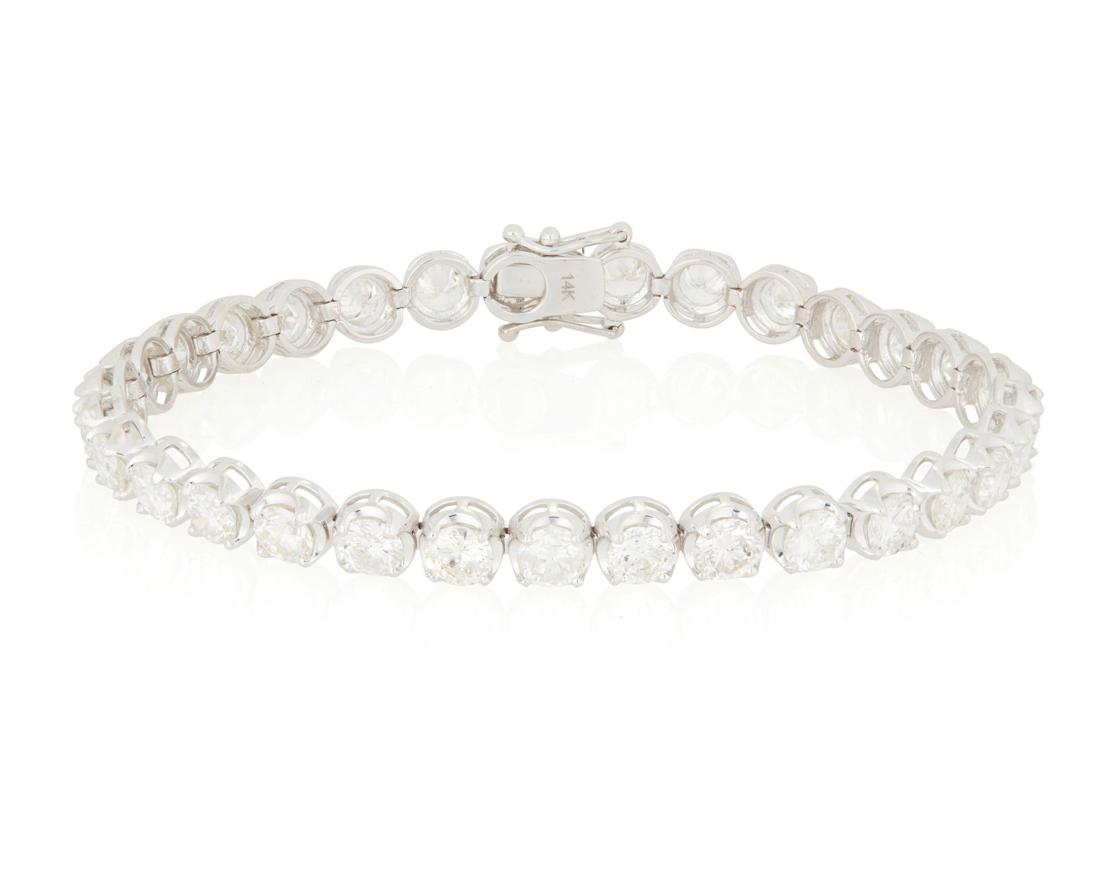 A 14K White Gold and Diamond Bracelet: A 14K White Gold and Diamond BraceletFeaturing thirty-one round diamonds weighing approximately 9.85 caratsLength: 7 in.12.5 grams gross