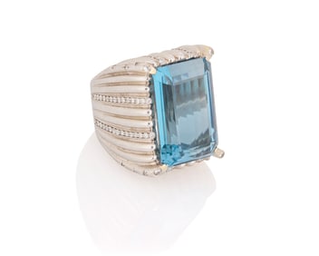 An 18K White Gold, Blue Topaz, and Diamond Ring