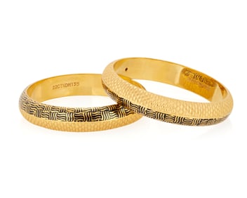 A Pair of 22K Gold and Enamel Bangles