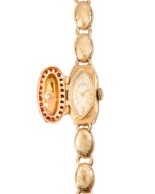 Lucien Piccard: A 14K Gold, Garnet and Diamond Surprise Watch