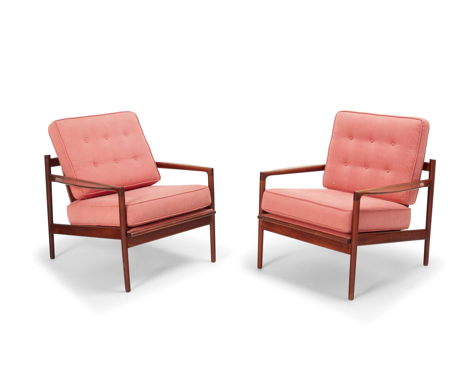 Ib Kofod-Larsen (1921-2003), A pair of 'Picket Back' lounge chairs for Selig, circa 1960s: Ib Kofod-Larsen (1921-2003)A pair of 'Picket Back' lounge chairs for Selig, circa 1960sEach with inset tag: Made and Finished / in Denmark / Imported by SeligThe walnut frames with four-slatted backs