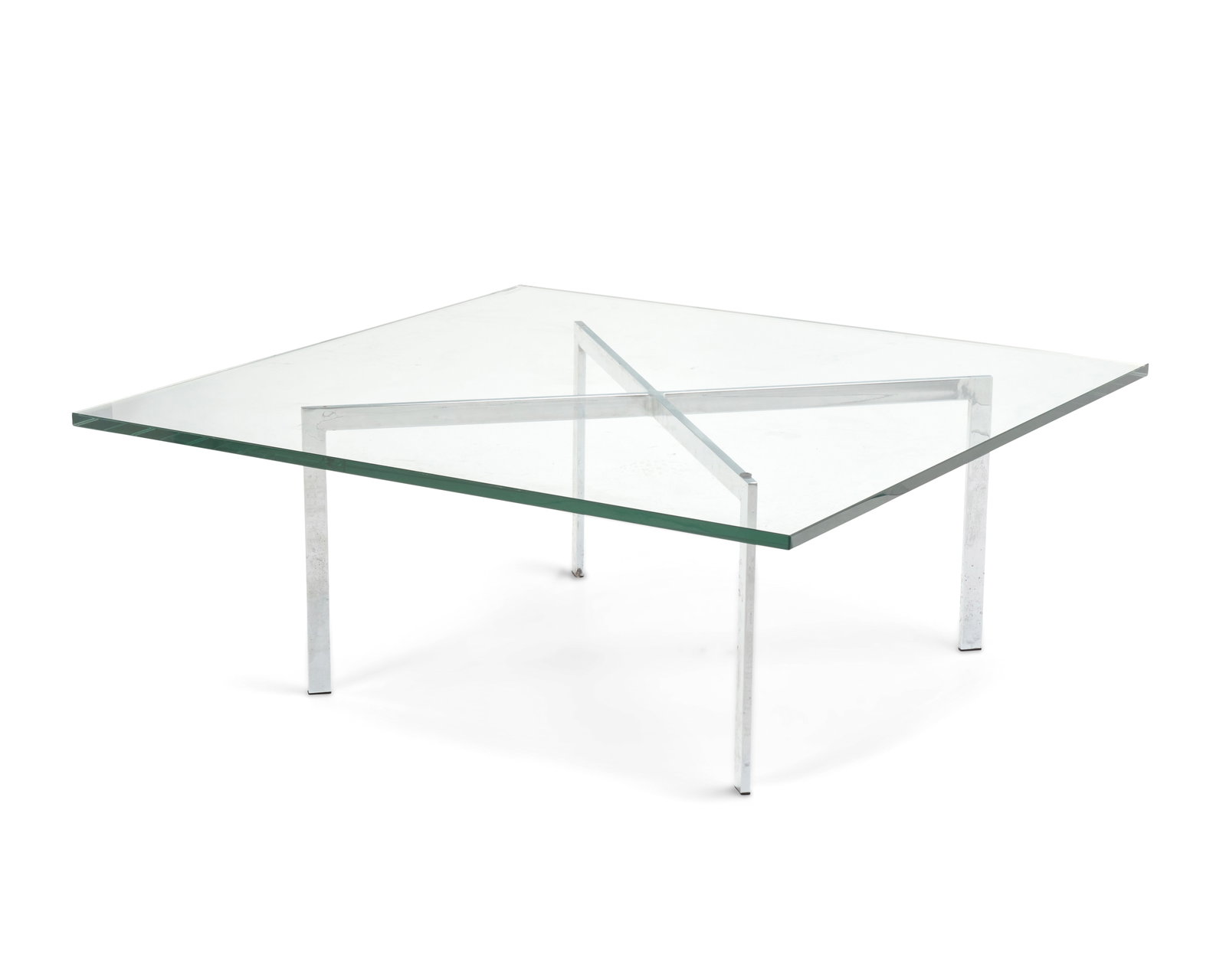 After Ludwig Mies van der Rohe (1886-1969), A table after the 'Barcelona' table for Knoll Studio, (1 of 7)