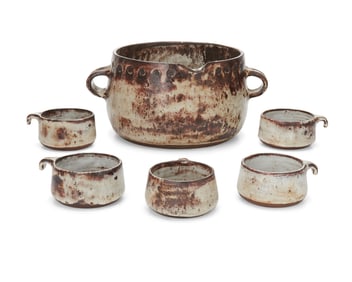 A glazed studio pottery soup crock and bowls
