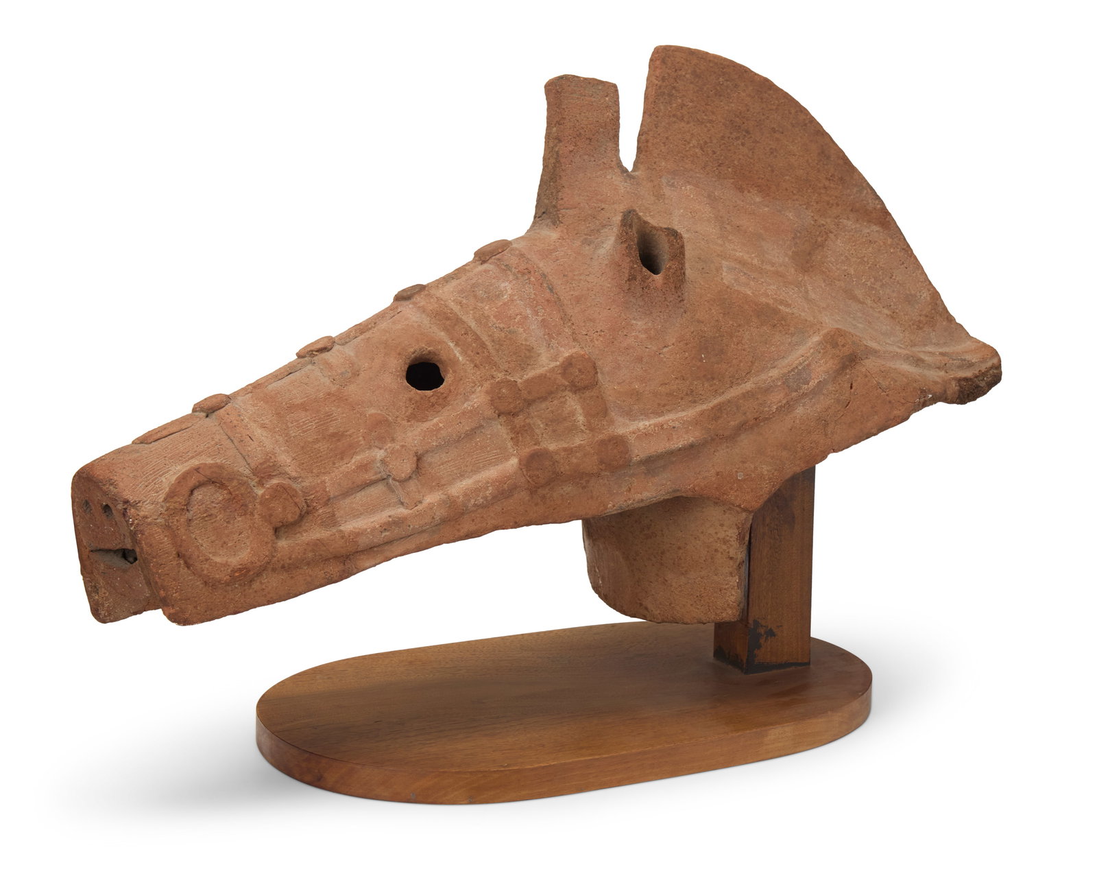 A Japanese terracotta Haniwa horse head: A Japanese terracotta Haniwa horse headKofun Period (300-538 CE) or laterSet on a custom wood baseHead: 14.5" H x 24" W x 8.75" D; Overall: 15.75" H Provenance:The Estate of Mario Armond Zamparelli, L