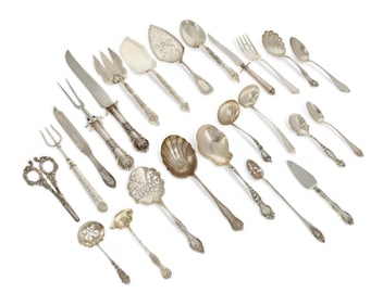 A group of sterling silver flatware items and serving utensils