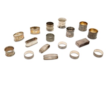 A group of silver and metal napkin rings