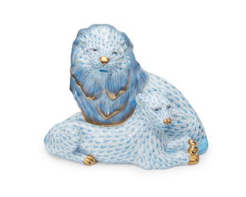 A Herend porcelain fishnet lion figural group