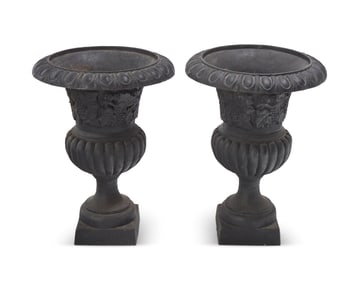 A pair of Victorian cast iron jardinieres