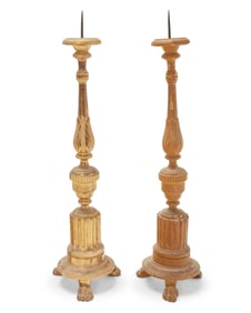 A pair of carved wood altar sticks