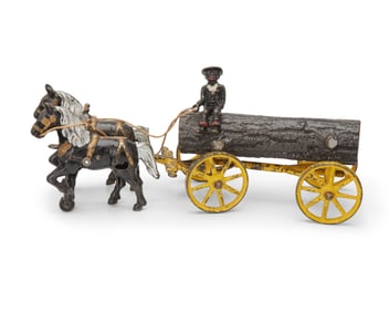A Kenton cast iron log wagon toy