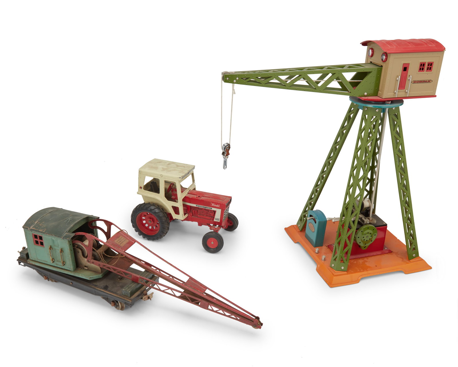 A group of toys including a tractor and two cranes (1 of 7)