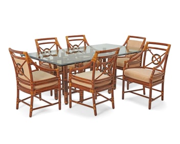 A McGuire bamboo dining table and six 'Target' armchairs