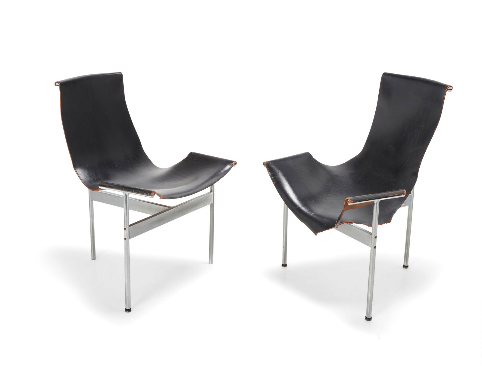 William Katavolos (1924-2020), Ross Littell (1924-2000) & Douglas Kelley (b. 1928), A pair of 'T': William Katavolos (1924-2020), Ross Littell (1924-2000) & Douglas Kelley (b. 1928)A pair of 'T' chairs for Laverne Originals, mid-20th centuryDesigned 1952With steel frames and original black leather