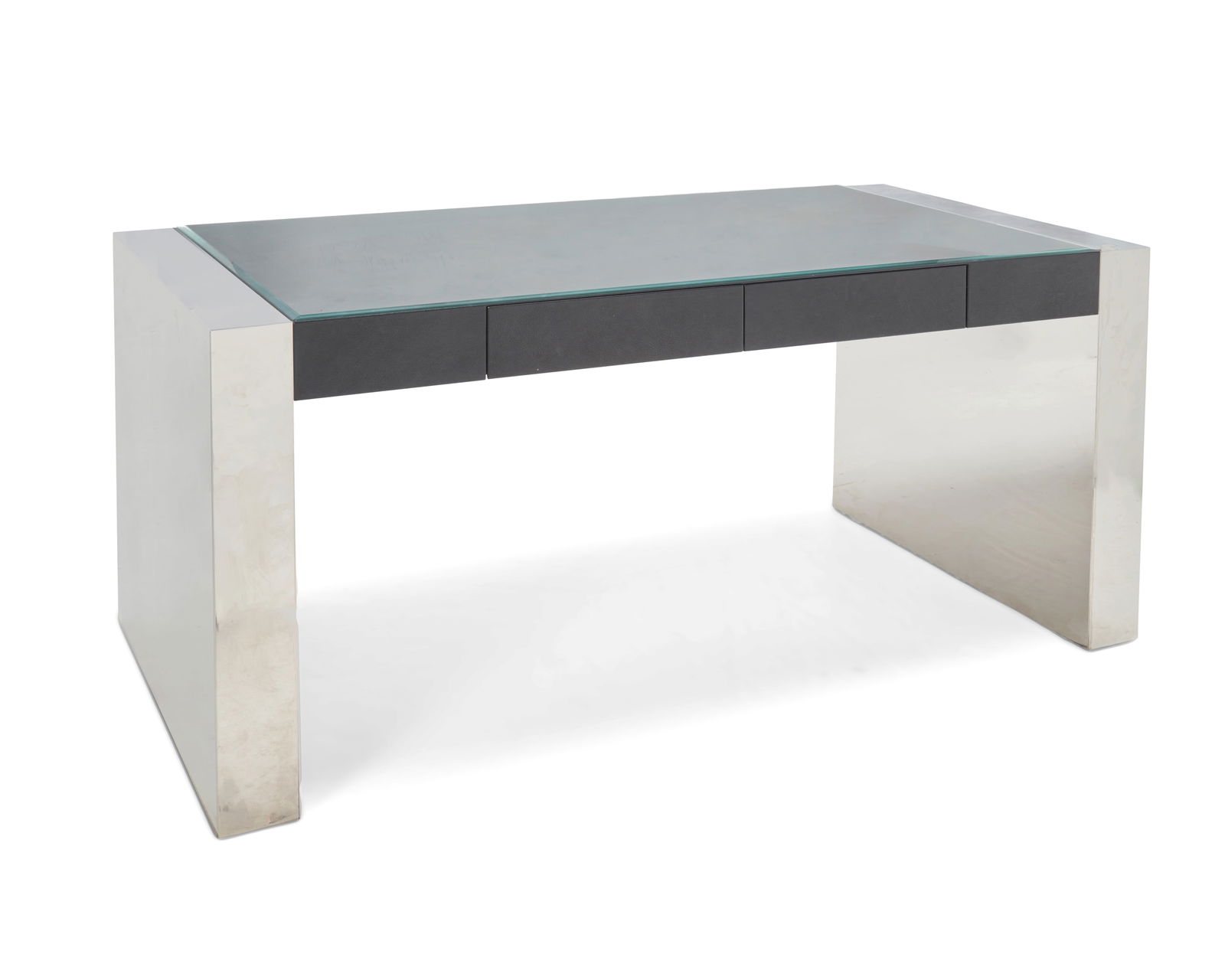 A Modern chrome and glass desk: A Modern chrome and glass deskLate 20th centuryThe waterfall-style desk with a faux-leather-clad wood console housing two drawers and surmounted by a beveled glass top, centering chromed metal support