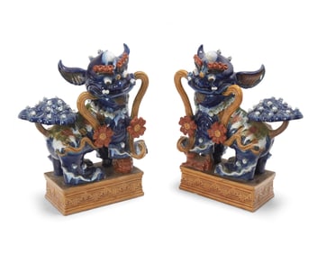 A pair of large Chinese porcelain guardian lion figures
