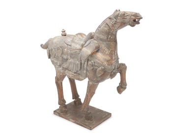 A large Chinese Tang-style carved wood horse figure