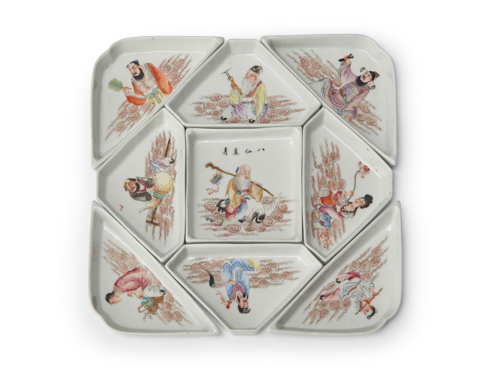 A Chinese porcelain sweet-meat set: A Chinese porcelain sweet-meat set20th centuryCentral tray with Chinese inscriptionThe nine-piece set of enameled ceramic dishes, each depicting figural scenes, set in a glazed wood boxOverall: 3" H x