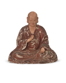 A Japanese carved wood monk figure