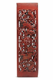 An Asian lacquered carved wood panel