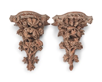 Two carved wood wall brackets