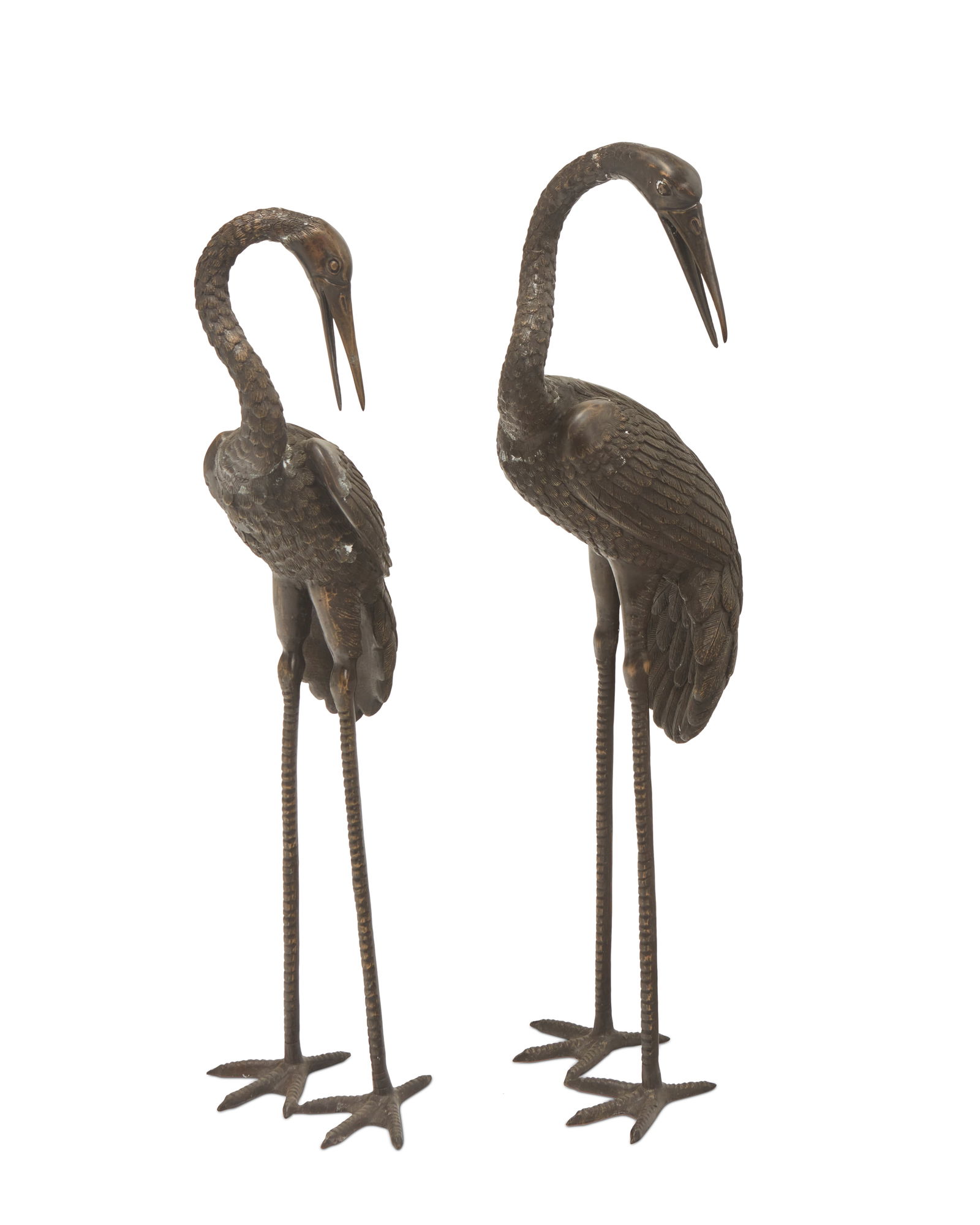 Two bronze bird figure garden ornaments: Two bronze bird figure garden ornamentsLate 20th/early 21st century2 piecesTaller: 37.75" H x 11.75" W x 11" D; Shorter: 35.75" H x 10.75" W x 10" D