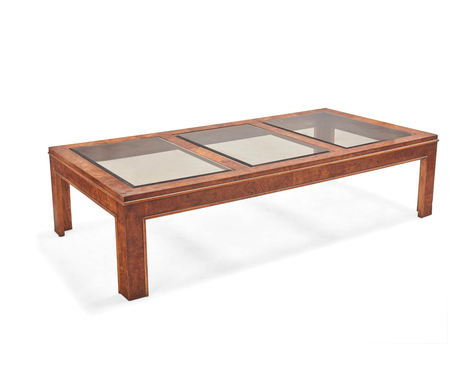 A Glenn of California burlwood coffee table: A Glenn of California burlwood coffee tableLate 20th centuryThe table with three inset smoky glass panels15" H x 60.5" W x 30.5" D Provenance:Estate of Robert Baron, Huntington Beach, CA