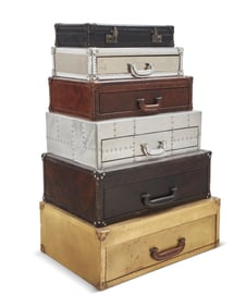 A Contemporary stacked suitcase dresser