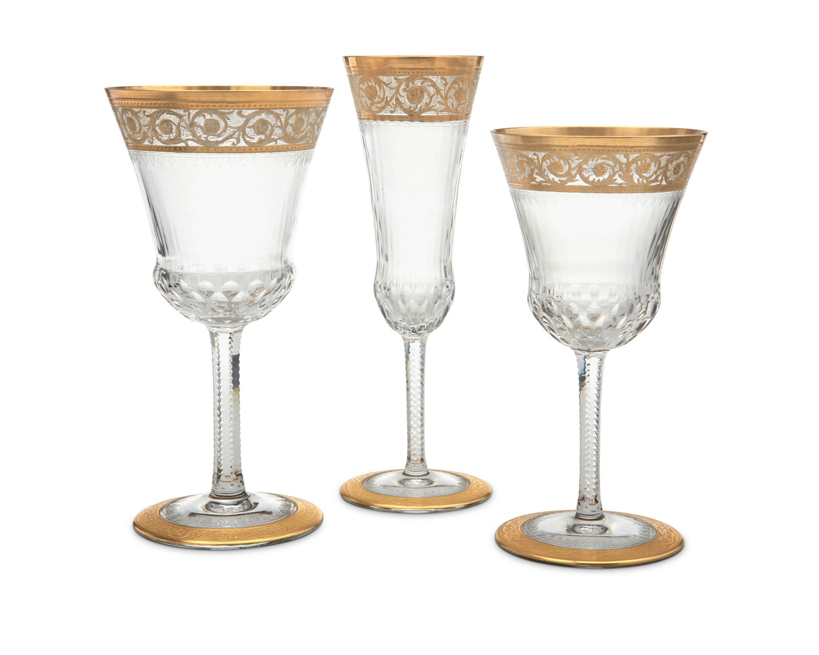 A Saint-Louis glass 'Thistle' stemware service: A Saint-Louis glass 'Thistle' stemware serviceLate 20th/early 21st centurySome with factory stencil mark to undersideComprising 23 fluted champagne glasses (7.5"), 12 continental goblets (7"), and 12
