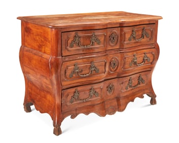 A Louis XV walnut bombe commode
