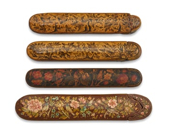 A group of Persian polychrome wood and papier-m‚che floral pen boxes